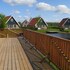 campsite combined tents with kitchen and bathroom located near a pond