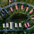 campsite combined tents with kitchen and bathroom located near a pond