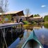 campsite combined tents with kitchen and bathroom located near a pond