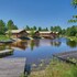 campsite combined tents with kitchen and bathroom located near a pond
