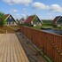 campsite combined tents with kitchen and bathroom located near a pond