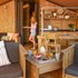 campsite combined tents with kitchen and bathroom located near a pond