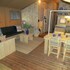 campsite combined tents with kitchen and bathroom located near a pond