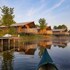 campsite combined tents with kitchen and bathroom located near a pond
