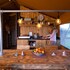 campsite combined tents with kitchen and bathroom located near a pond