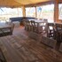 campsite combined tents with kitchen and bathroom located near a pond