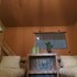 campsite combined tents with kitchen and bathroom located near a pond
