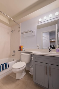 one hotel room with king bed and ac