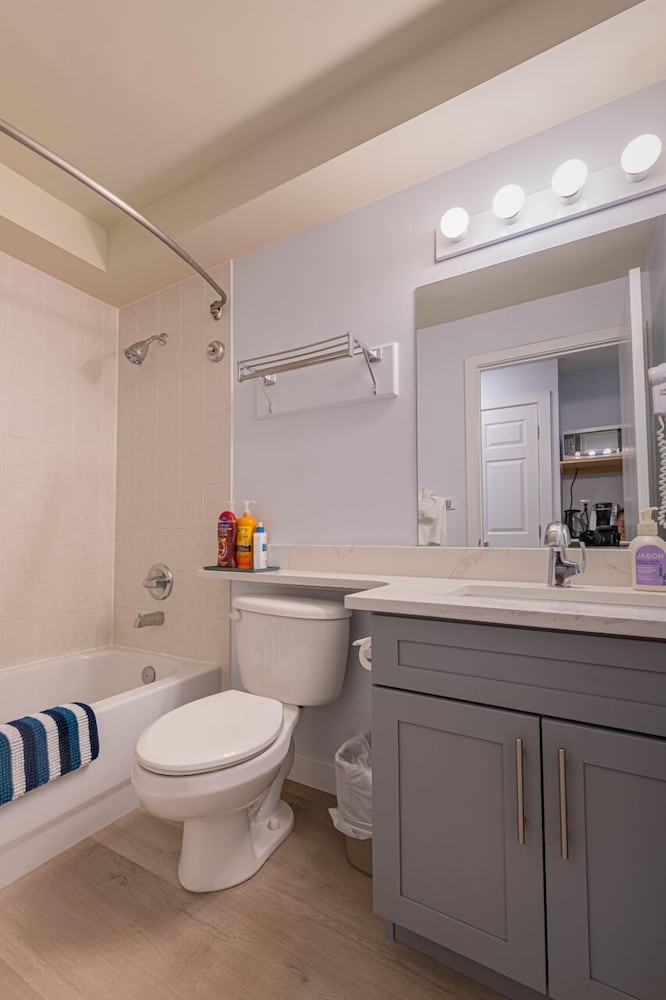 one hotel room with king bed and ac