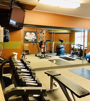 one hotel room with king bed and ac