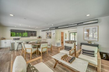 luxury riverfront villa with firepit and gameroom