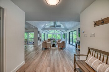 luxury riverfront villa with firepit and gameroom