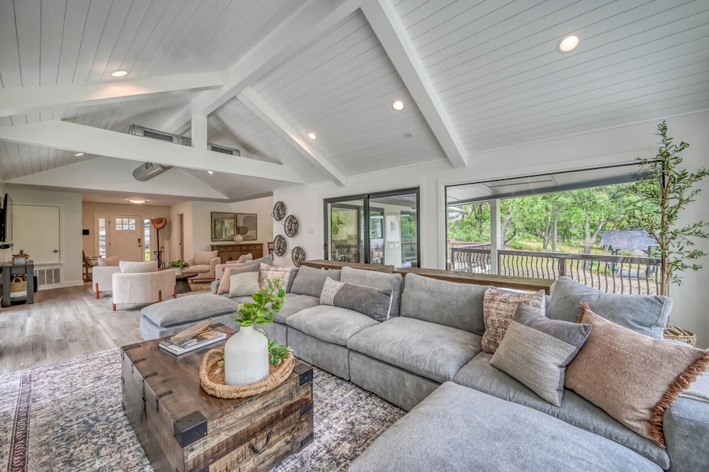 luxury riverfront villa with firepit and gameroom