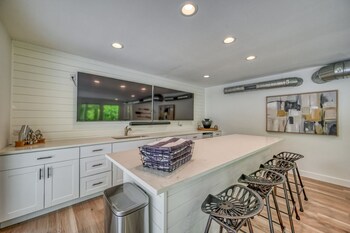 luxury riverfront villa with firepit and gameroom