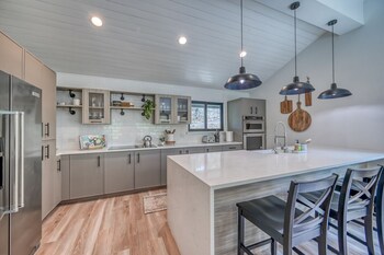 luxury riverfront villa with firepit and gameroom