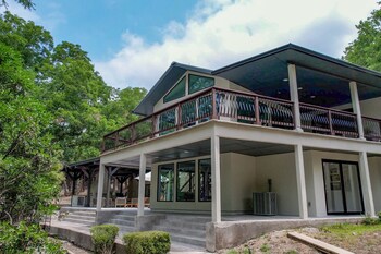 luxury riverfront villa with firepit and gameroom