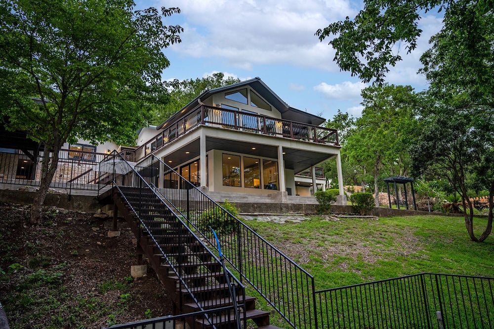 luxury riverfront villa with firepit and gameroom