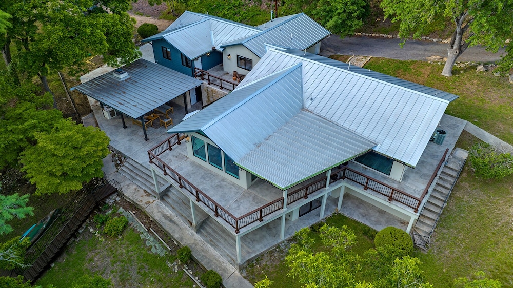 luxury riverfront villa with firepit and gameroom