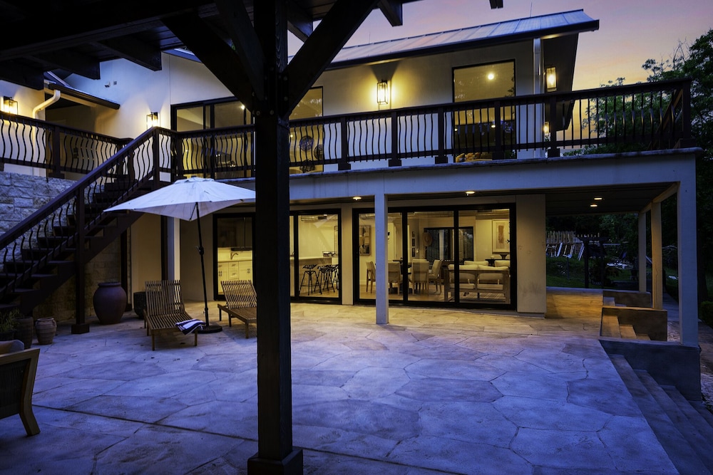 luxury riverfront villa with firepit and gameroom