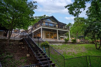 luxury riverfront villa with firepit and gameroom
