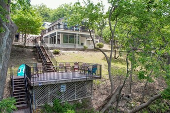 luxury riverfront villa with firepit and gameroom