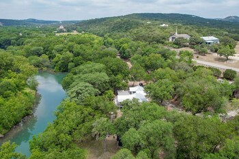 luxury riverfront villa with firepit and gameroom