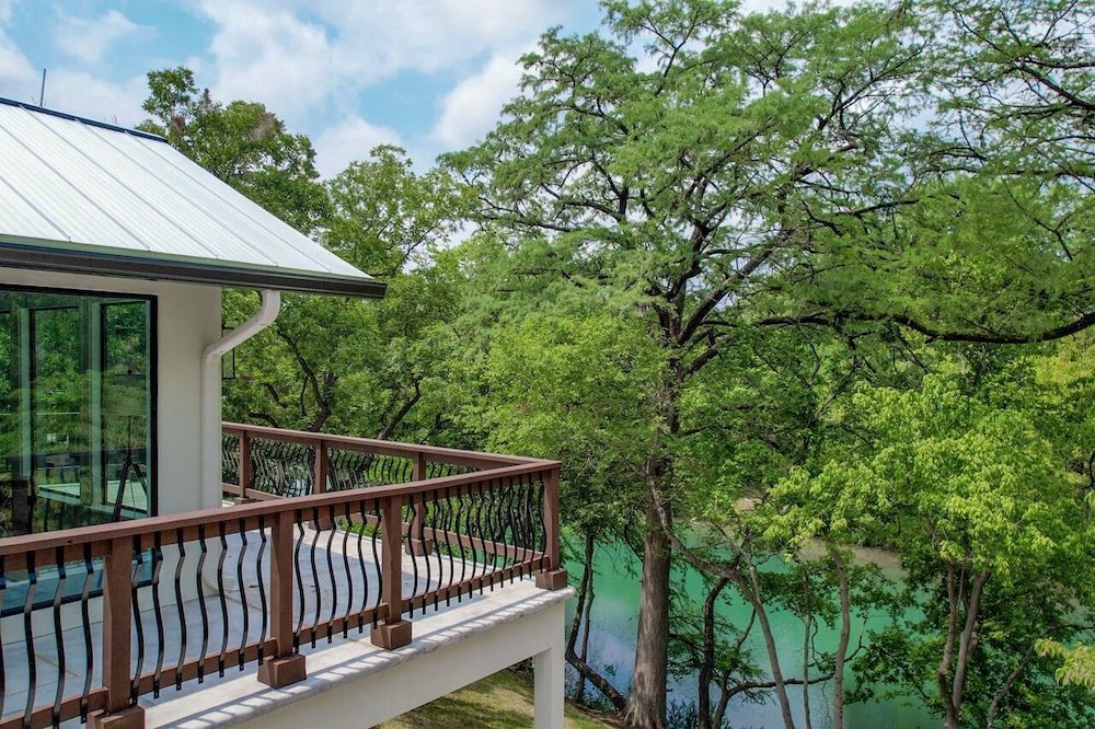 luxury riverfront villa with firepit and gameroom