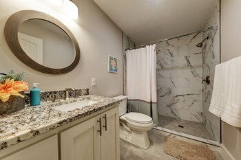 waterfront lake house with hot tub and firepit