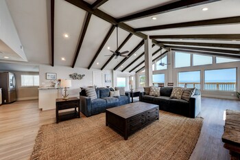 waterfront lake house with hot tub and firepit