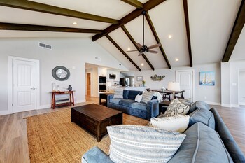 waterfront lake house with hot tub and firepit