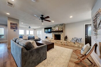 waterfront lake house with hot tub and firepit
