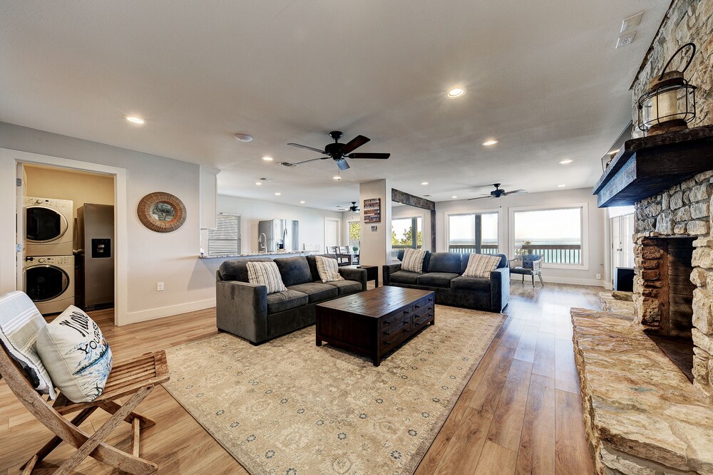 waterfront lake house with hot tub and firepit