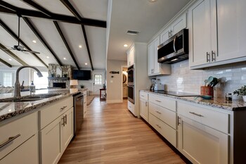 waterfront lake house with hot tub and firepit