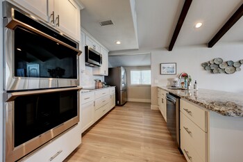 waterfront lake house with hot tub and firepit