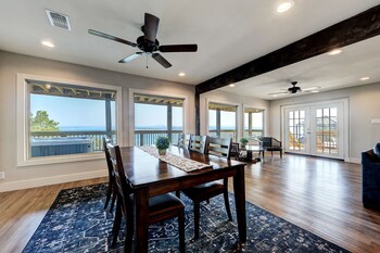waterfront lake house with hot tub and firepit