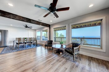 waterfront lake house with hot tub and firepit