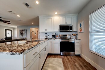 waterfront lake house with hot tub and firepit