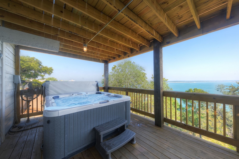 waterfront lake house with hot tub and firepit