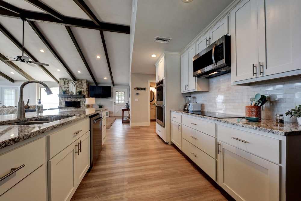 waterfront lake house with hot tub and firepit