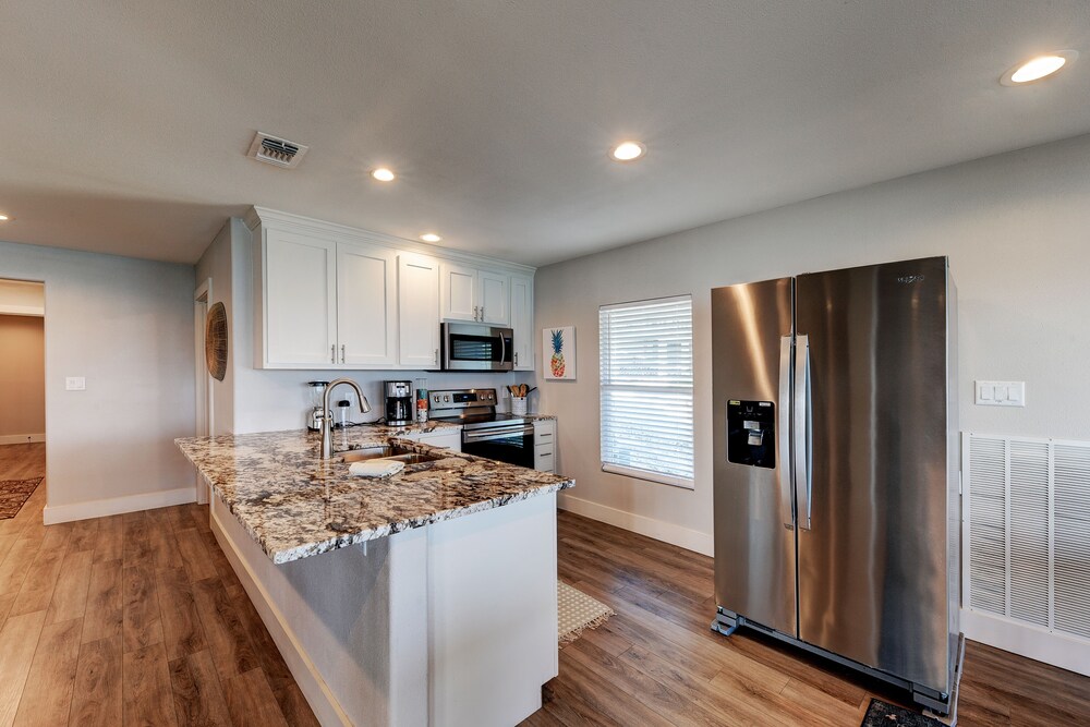 waterfront lake house with hot tub and firepit