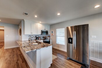 waterfront lake house with hot tub and firepit