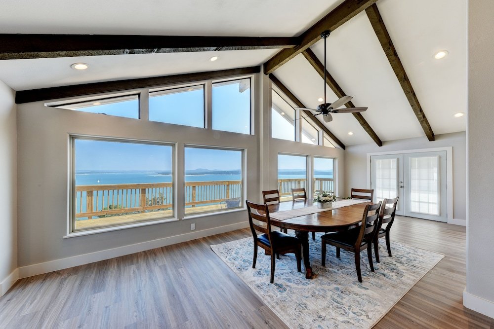 waterfront lake house with hot tub and firepit