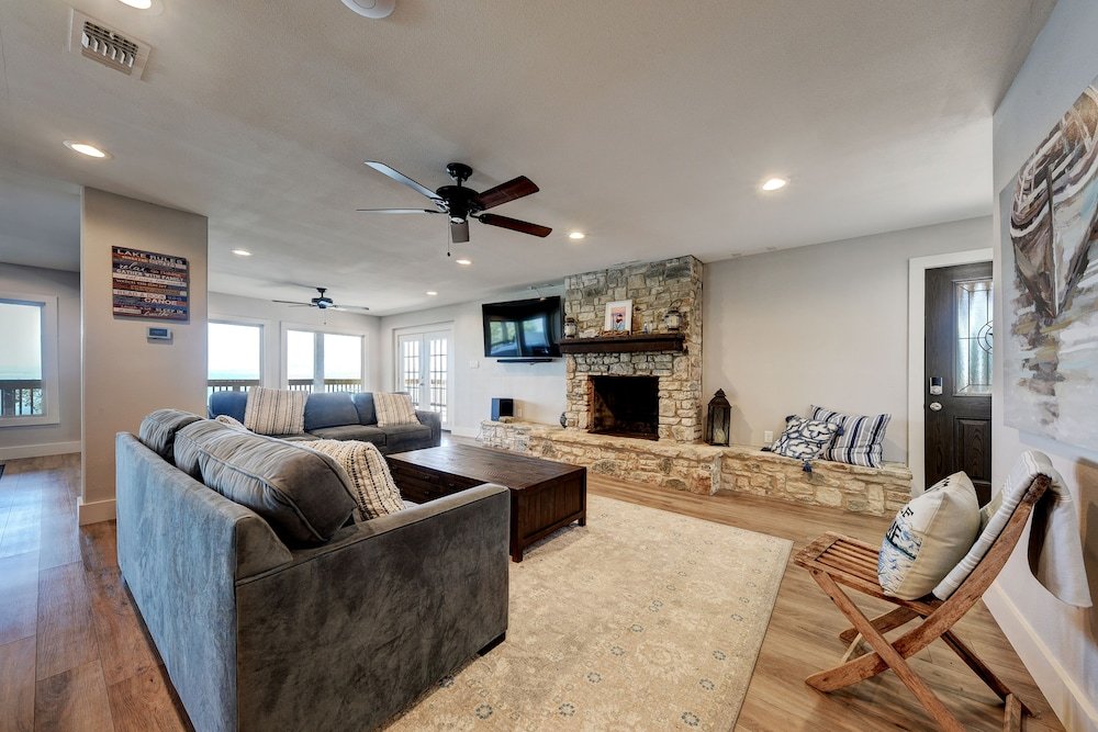 waterfront lake house with hot tub and firepit