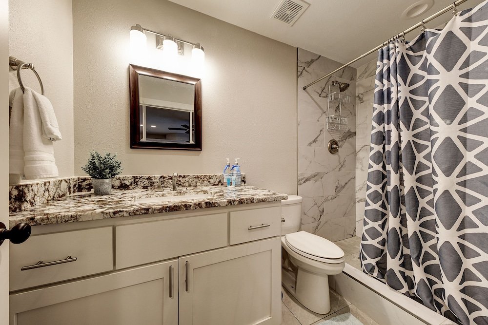 waterfront lake house with hot tub and firepit