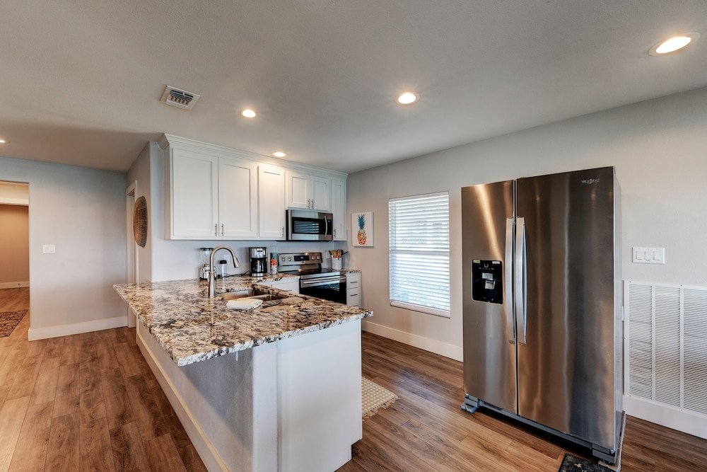 waterfront lake house with hot tub and firepit