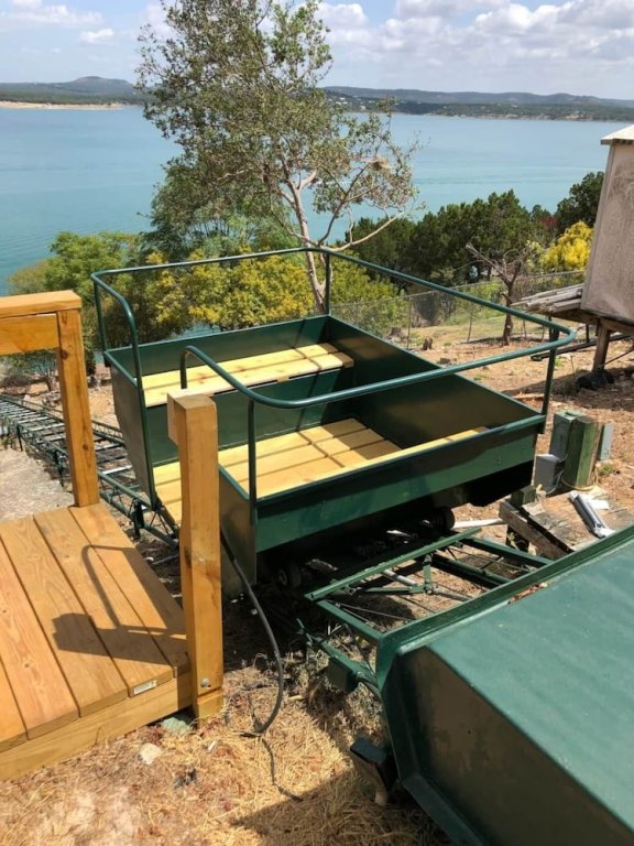 waterfront lake house with hot tub and firepit