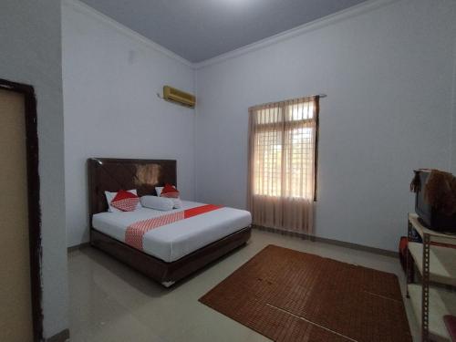 oyo 92587 homestay romauli kampung radja