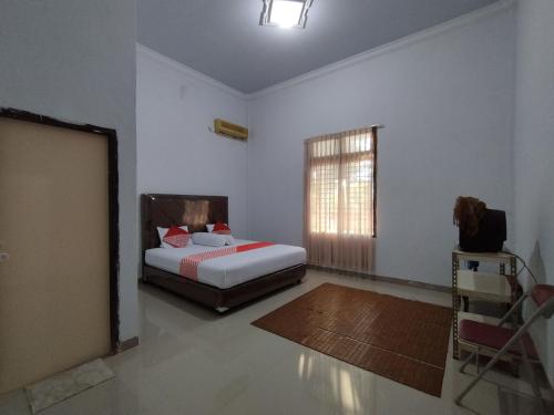 oyo 92587 homestay romauli kampung radja