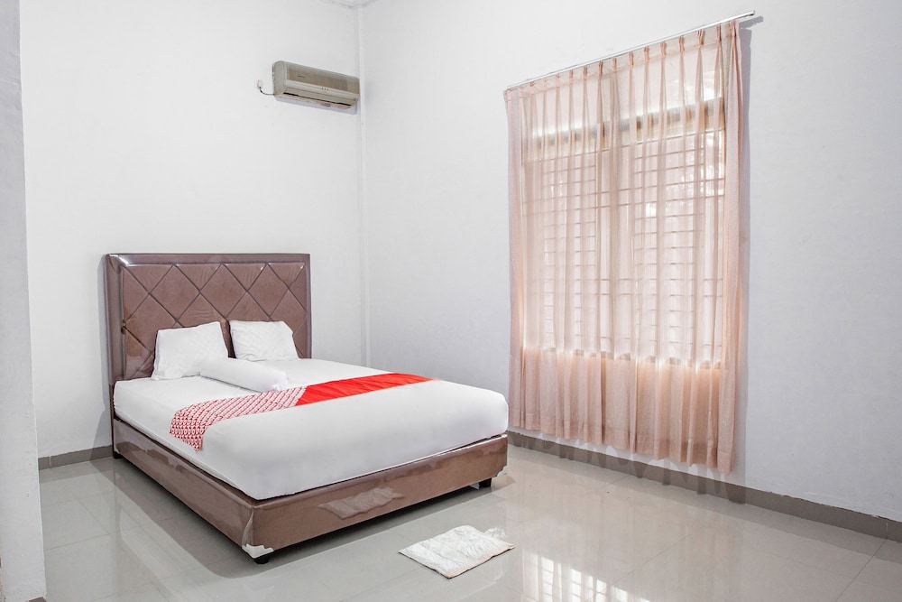 oyo 92587 homestay romauli kampung radja