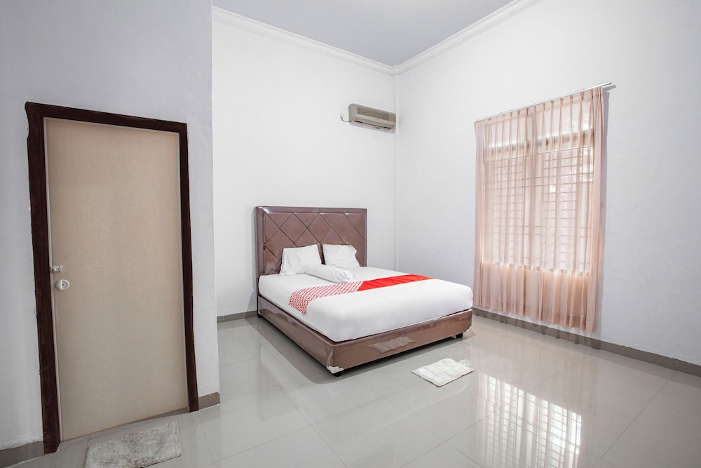 oyo 92587 homestay romauli kampung radja